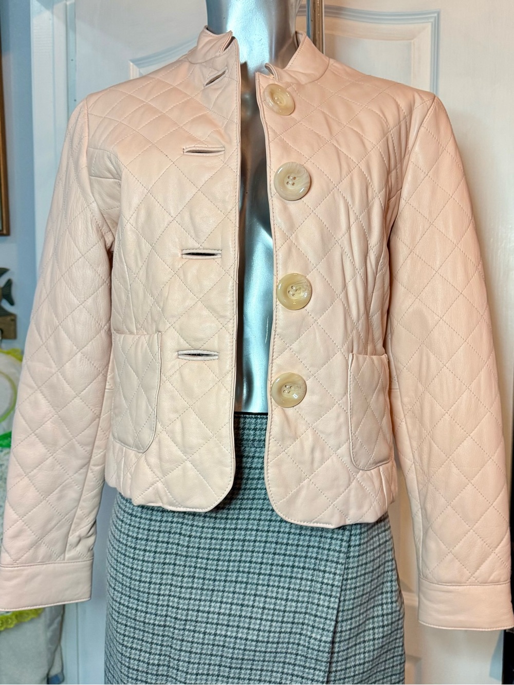 Wilsons Leather pink jacket with a black-and-white floral lining